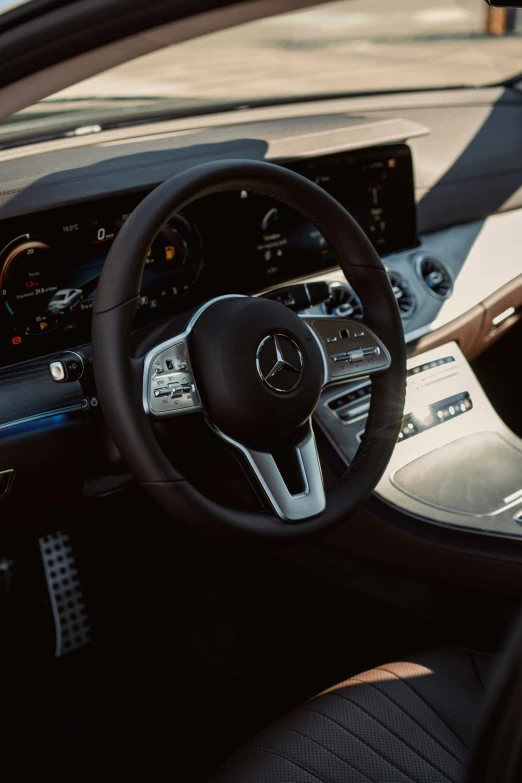 a dashboard view inside the mercedes benz coupe