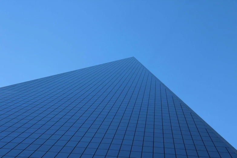 blue building is standing tall and looking upward