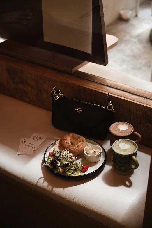 a plate of food and a bag sitting on a counter