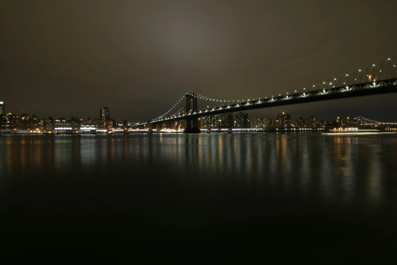 a river with lots of water and a bridge