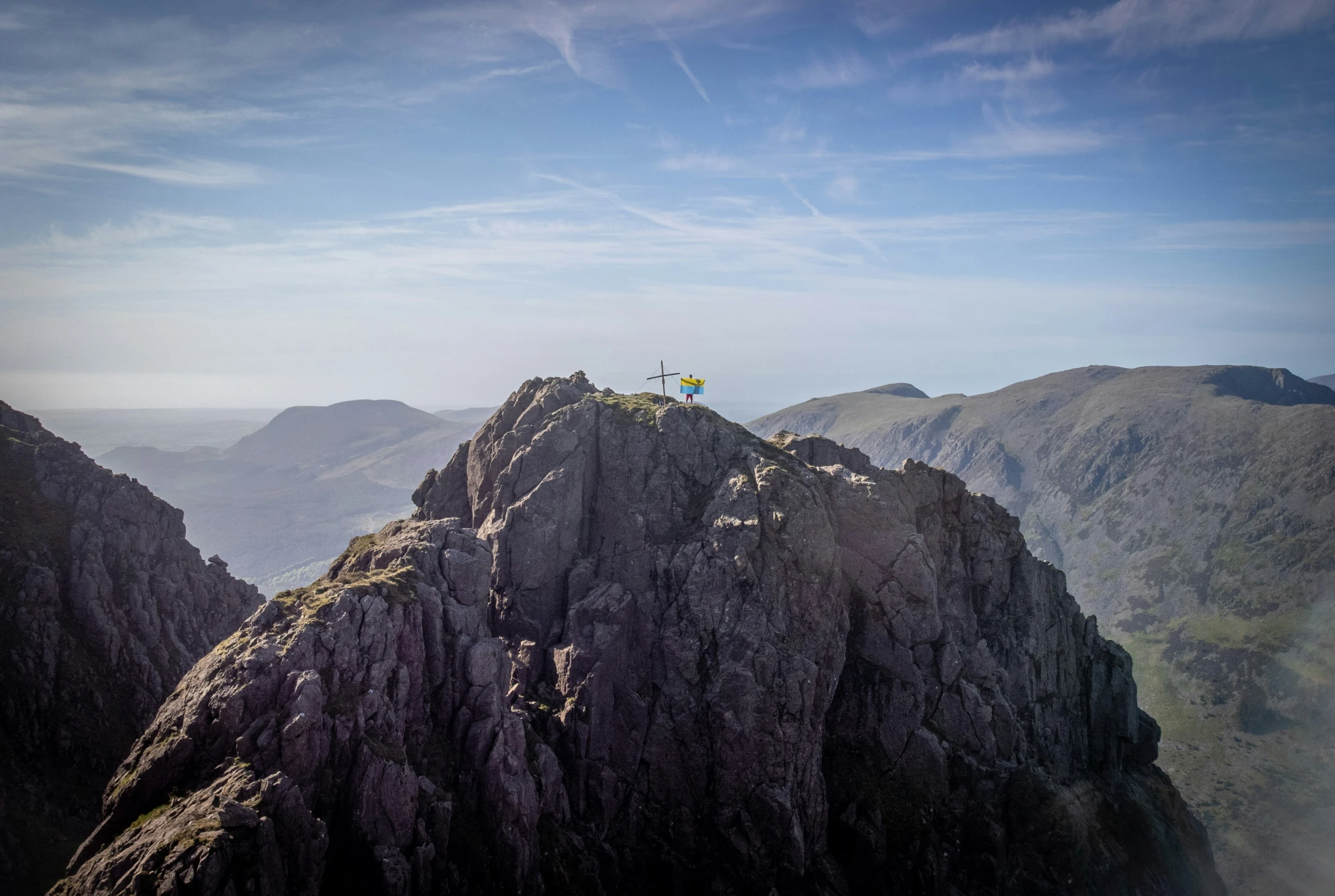 people standing on top of a mountain on top of it