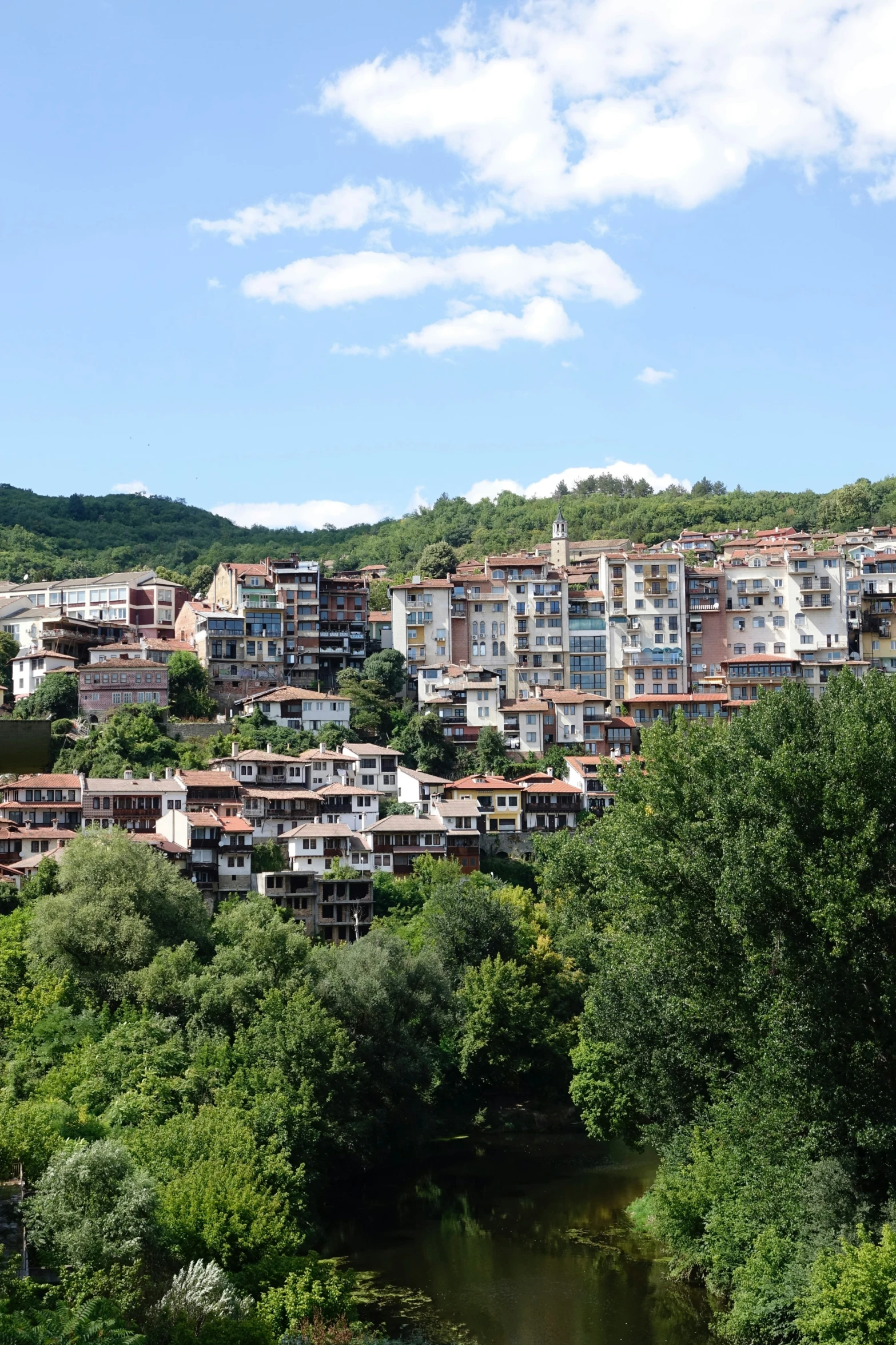 houses by the river on top of hill