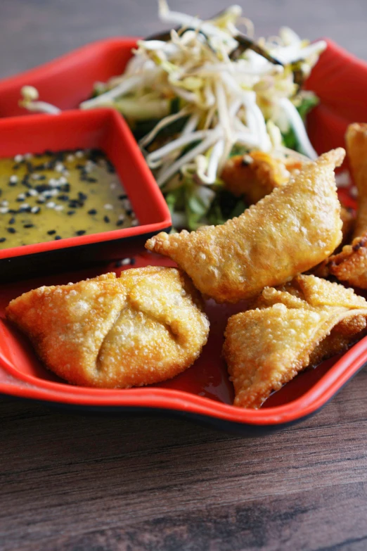 a dish filled with deep fried vegetable items