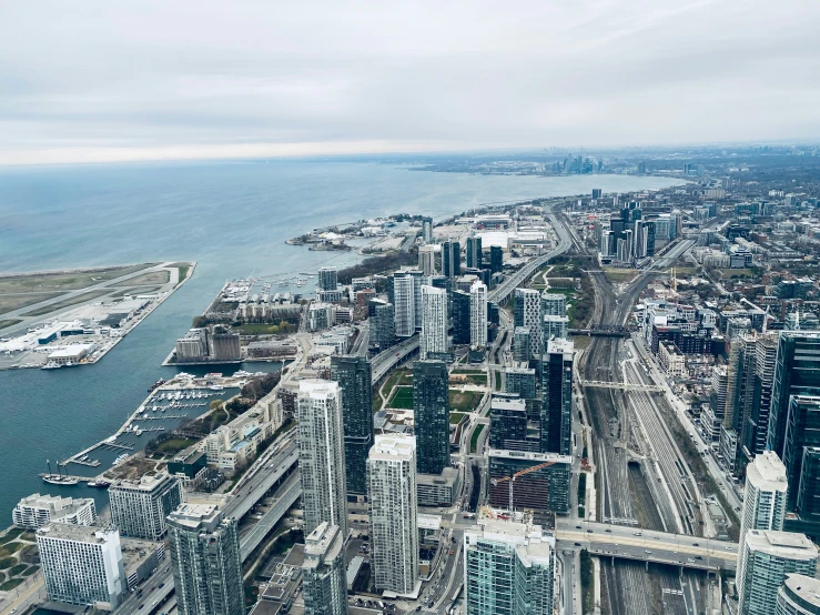 an aerial view of a city near a body of water