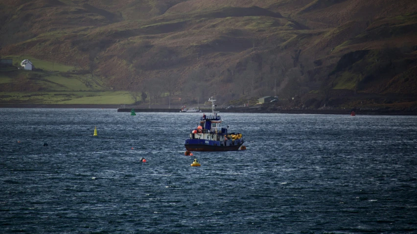 the boat is moving in the open water