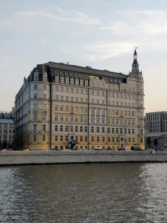 a building is shown next to the water