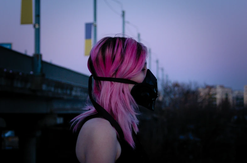 pink haired girl with black mask and black strap