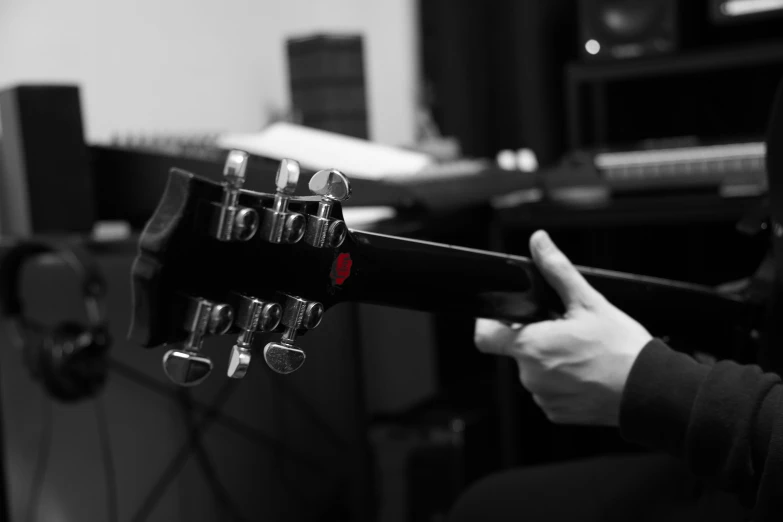 an acoustic guitar and amp in a recording studio