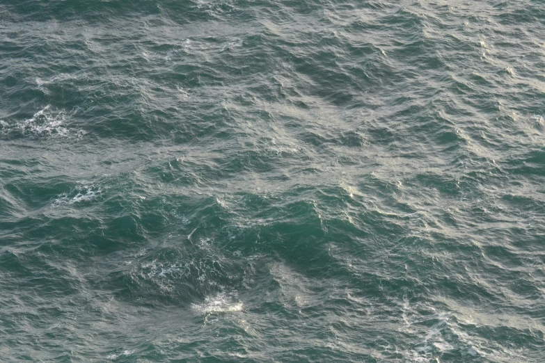 an over head view of water with white dots in it