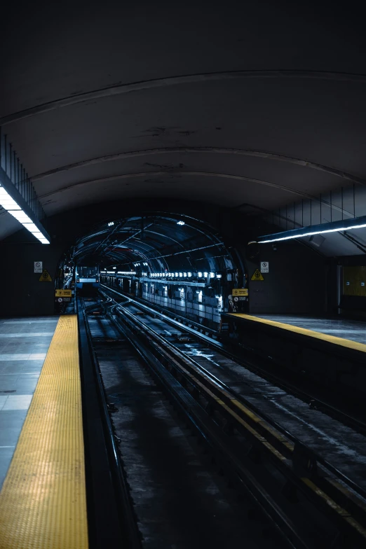 a train on the tracks in a tunnel