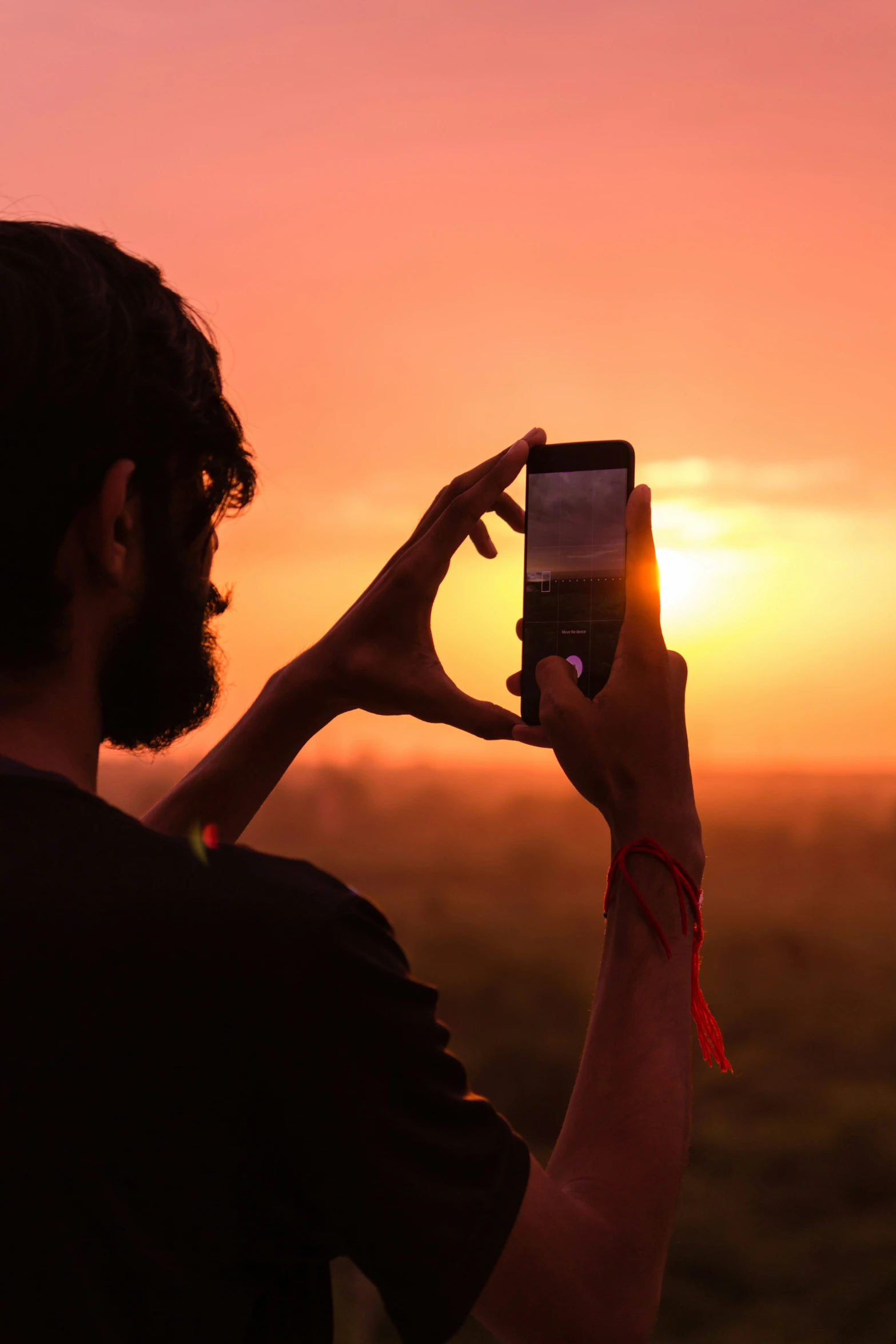 a person holding up a smart phone in their hands