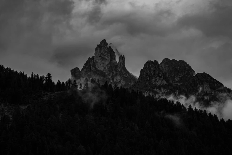 a group of tall mountains are seen in the distance