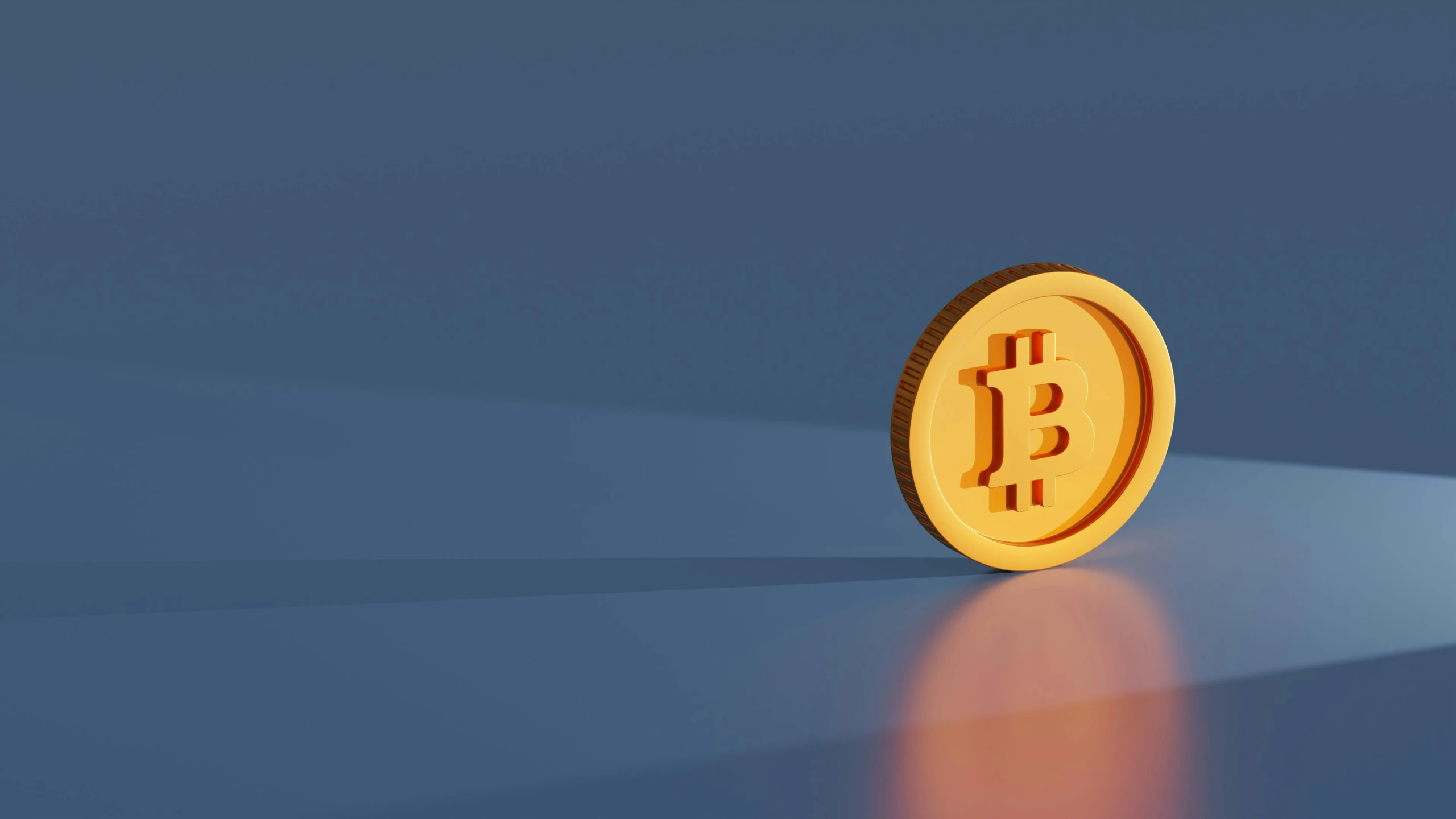 a golden bitcoin is shown with reflection in the background