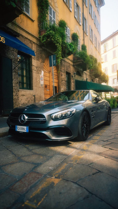 a mercedes benz s coupe driving down the street