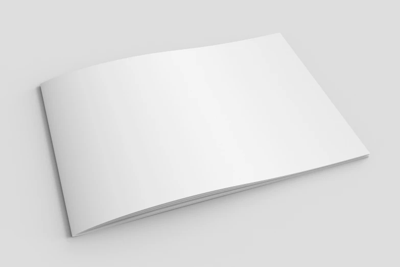 an open white magazine on a grey background