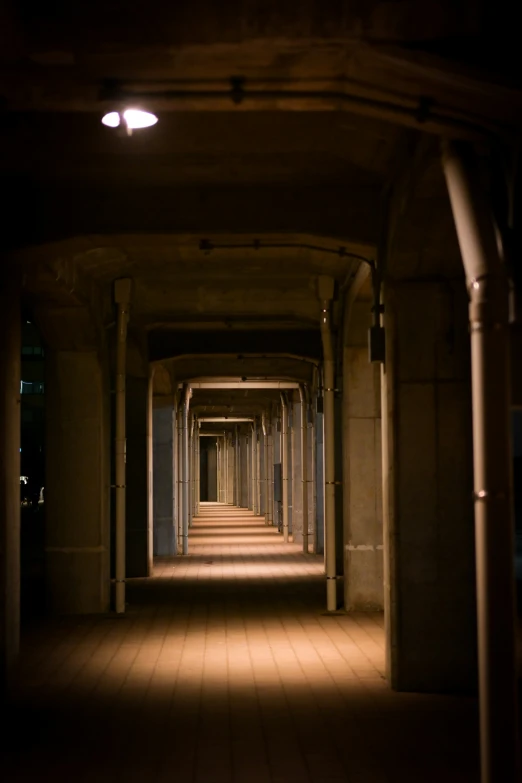 several lights glow brightly down this long corridor