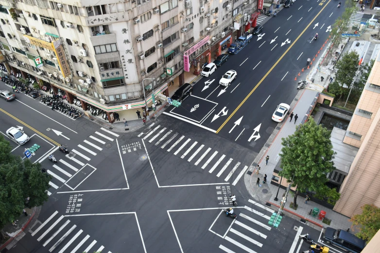 there are many vehicles crossing a street in the city