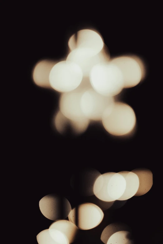 a close up of blurry white lights in the dark