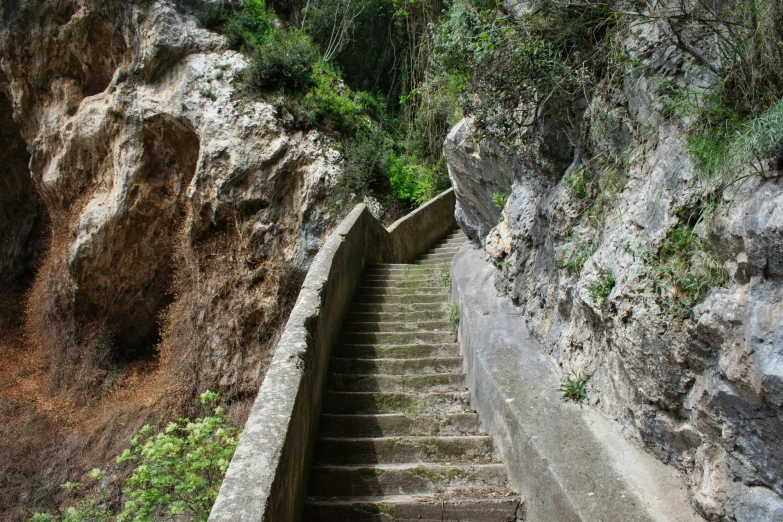 stairs that lead up a cliff into some cliffs