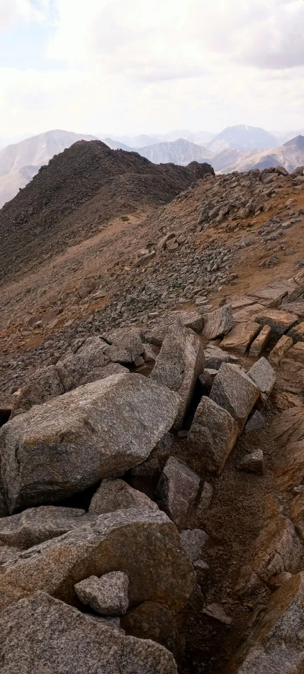 some very large rocks near a small hill