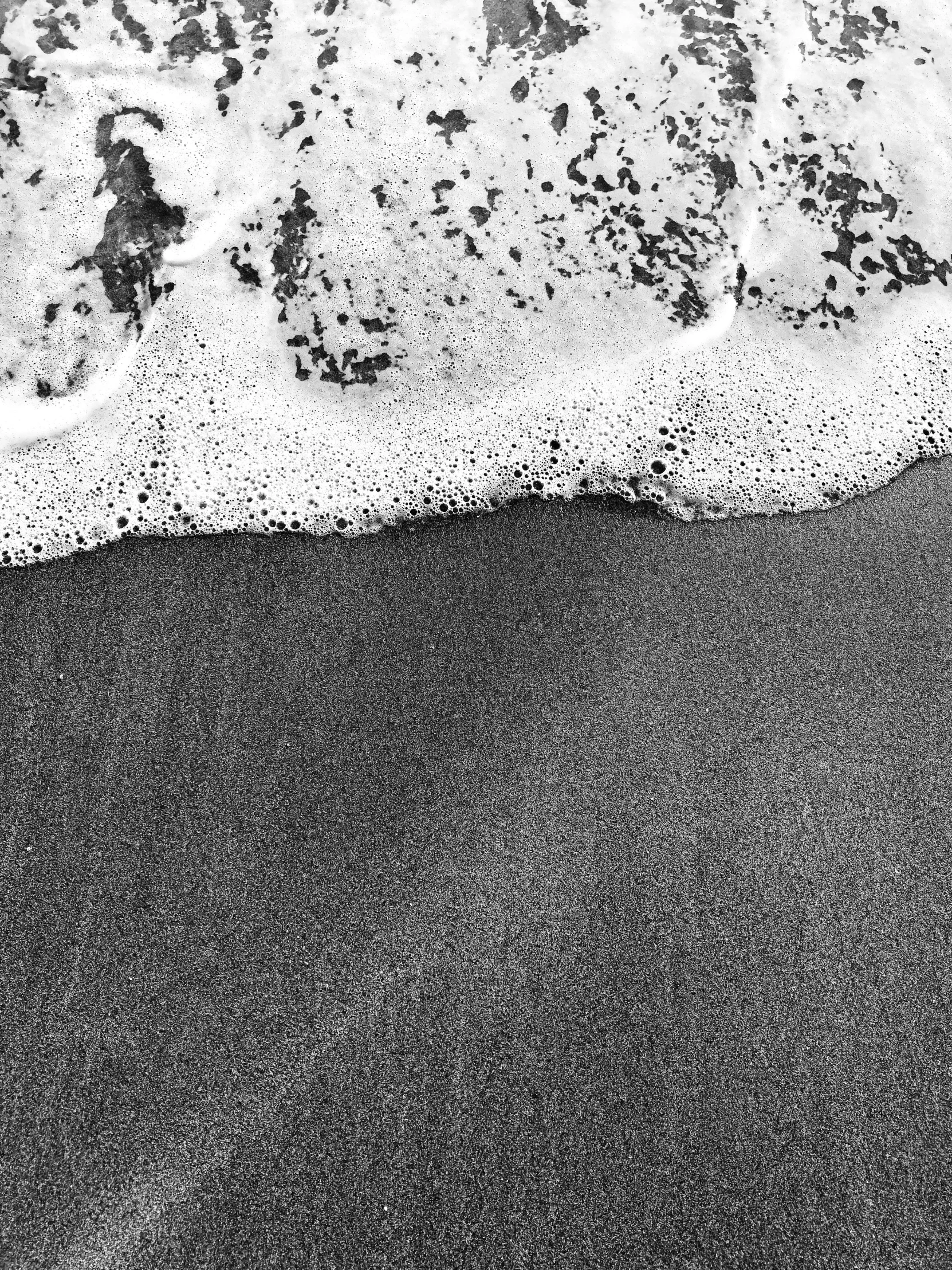 a black and white po of a black beach