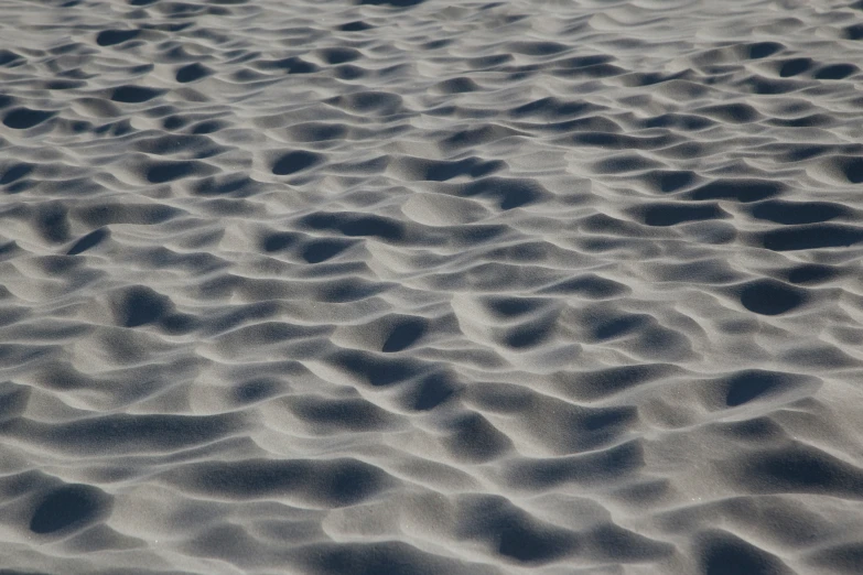 the top view of a bunch of sand that is covered with patterns