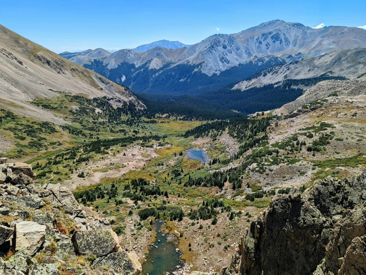 a valley is shown with mountains in the background