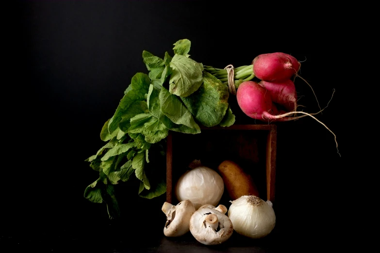 a pile of vegetables sit on a small shelf