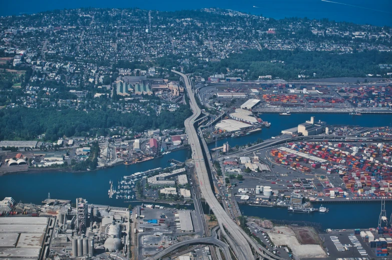 a city with a river and highway runs alongside it