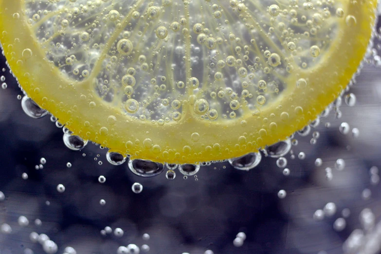 a close up of the water bubbles on a lemon