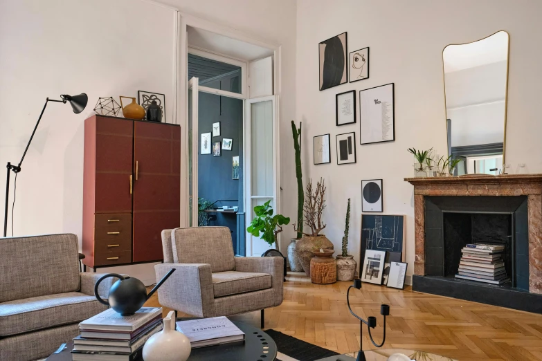 an old style living room with high ceiling and wooden floors