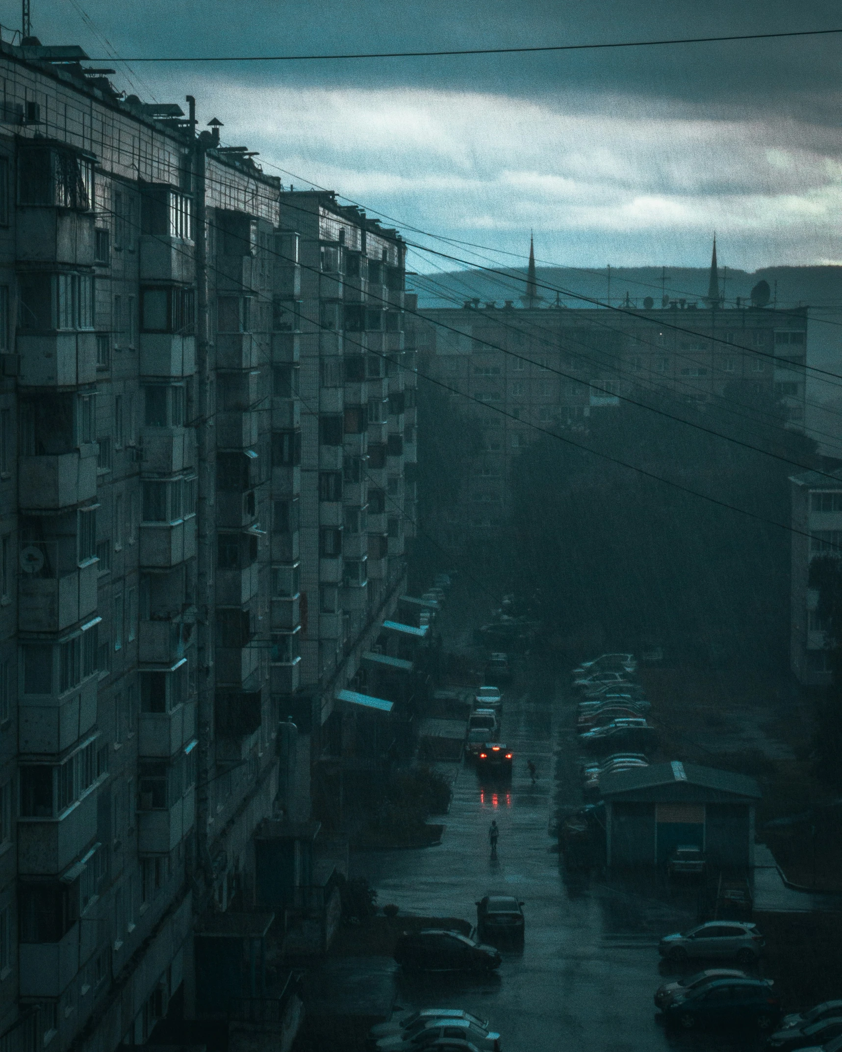 a street at night in the city of cars