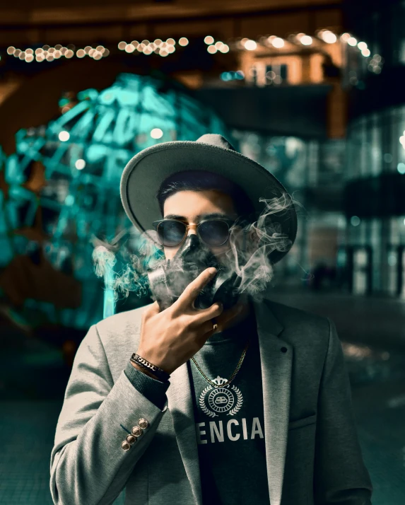 a man with a smoking cigarette wearing a suit and a hat