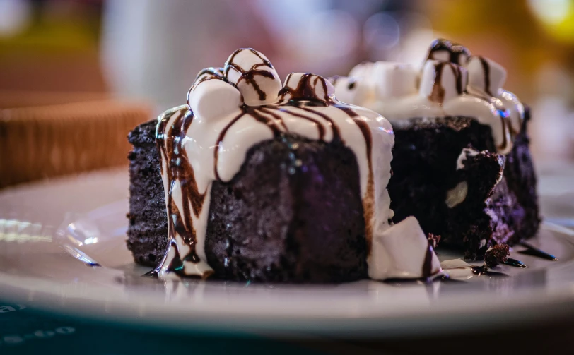 several pieces of cake are on a white plate