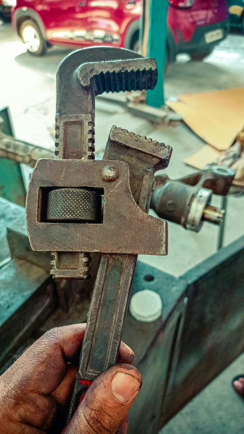 a large rusty piece of machinery in a workshop