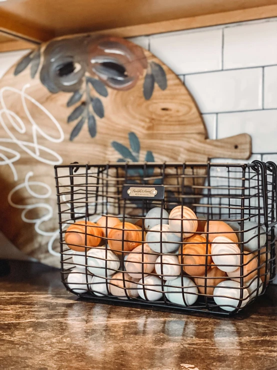 two baskets full of food sitting on a kitchen counter