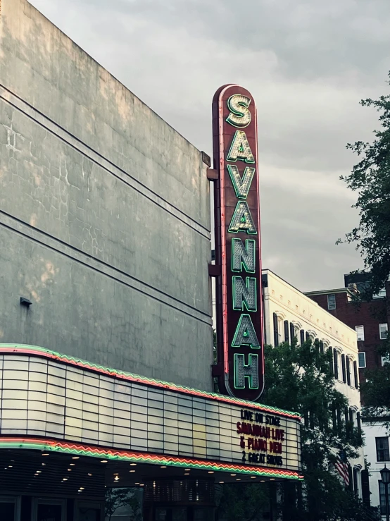 an old theater marquee is painted red and green