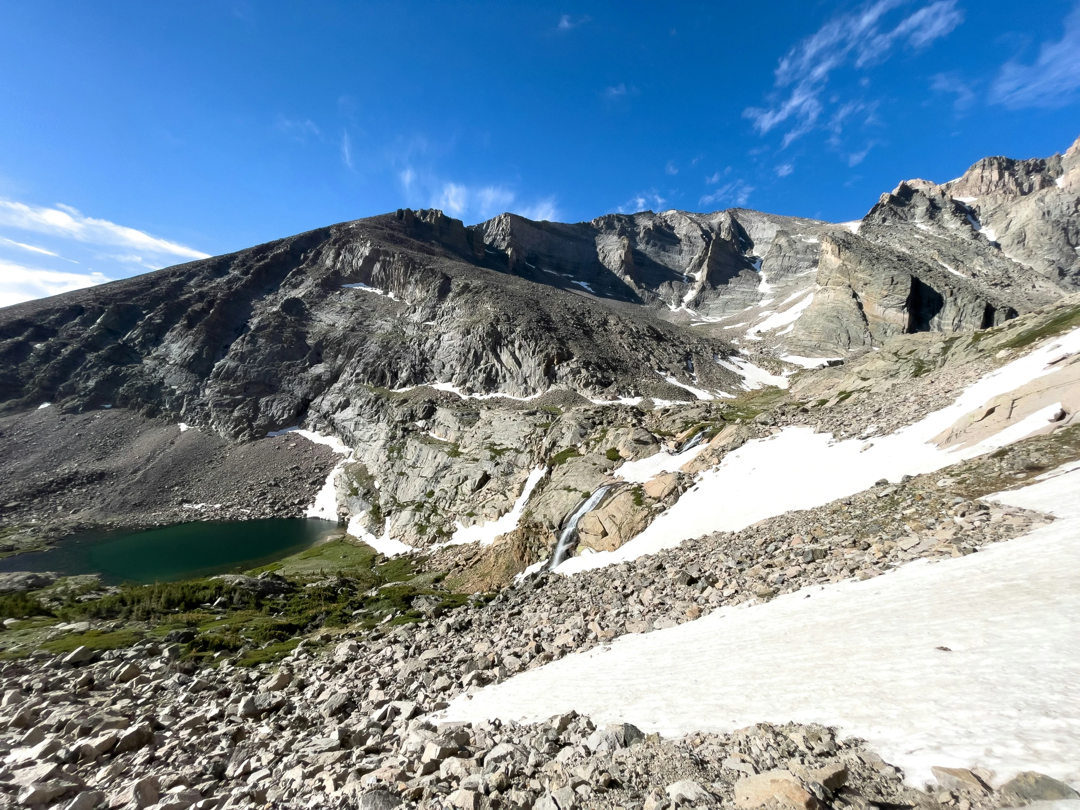 the view from an overlook point at mountains and lakes