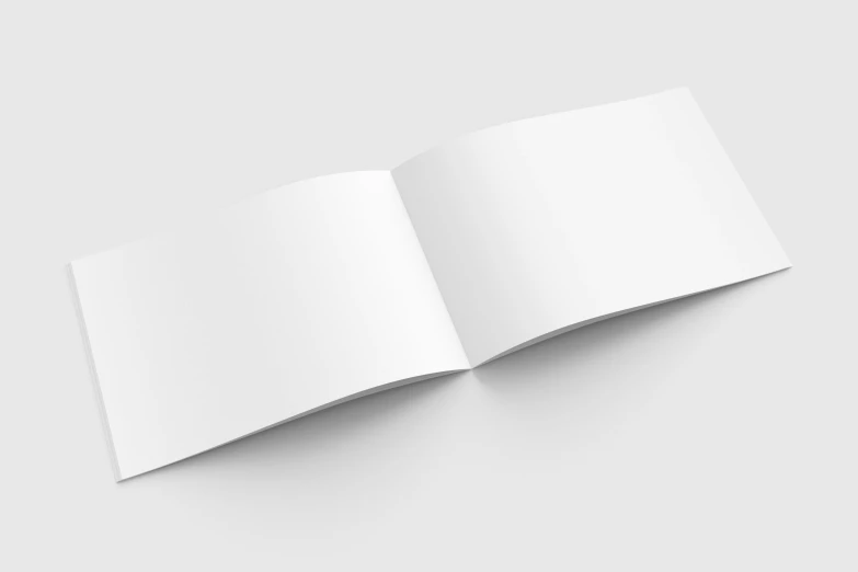 an open book with white paper on a table