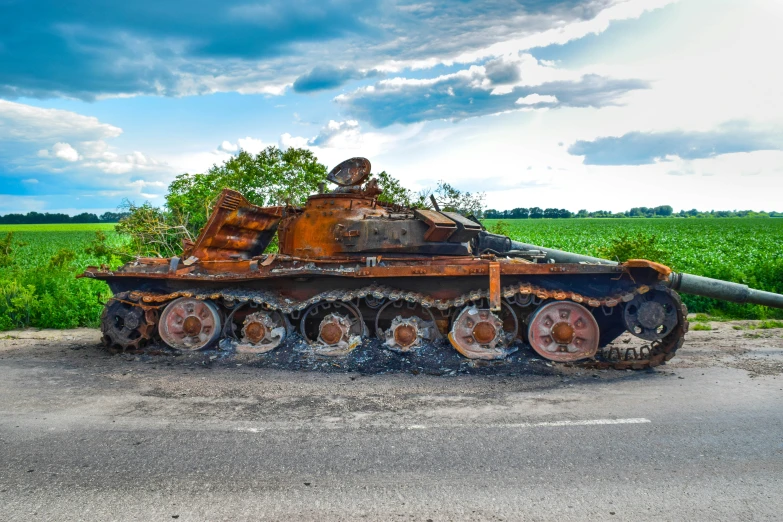 an old rusted up train laying in the middle of the country