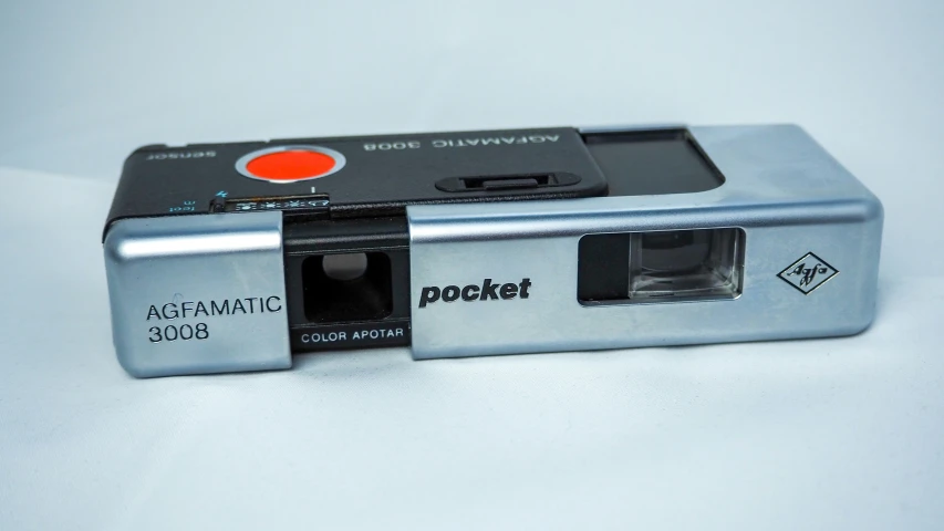 a picture camera is shown on a white surface