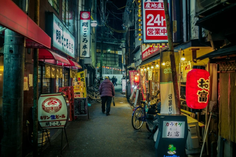 an oriental street covered in signs with writing in english and japanese