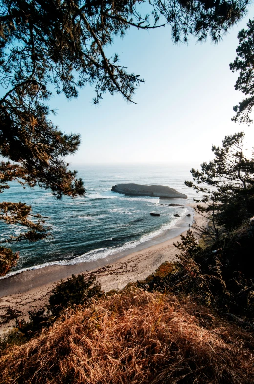 a scenic scene with a beach in the distance