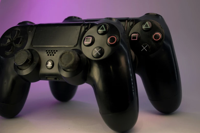 the sony playstation playstation controller is set on top of each other