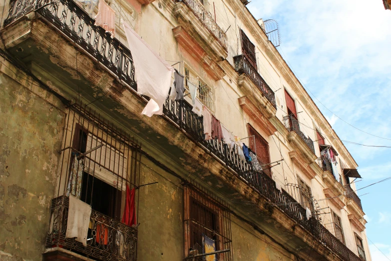 a very old building that has some clothes hanging outside