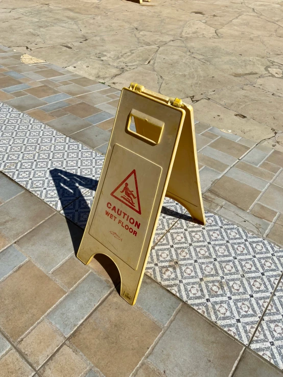 a street sign with a warning triangle for caution