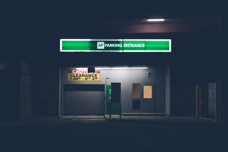 a parking garage sign that is above a door