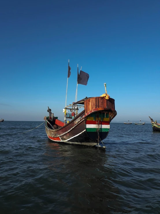 two boats in the water near one another