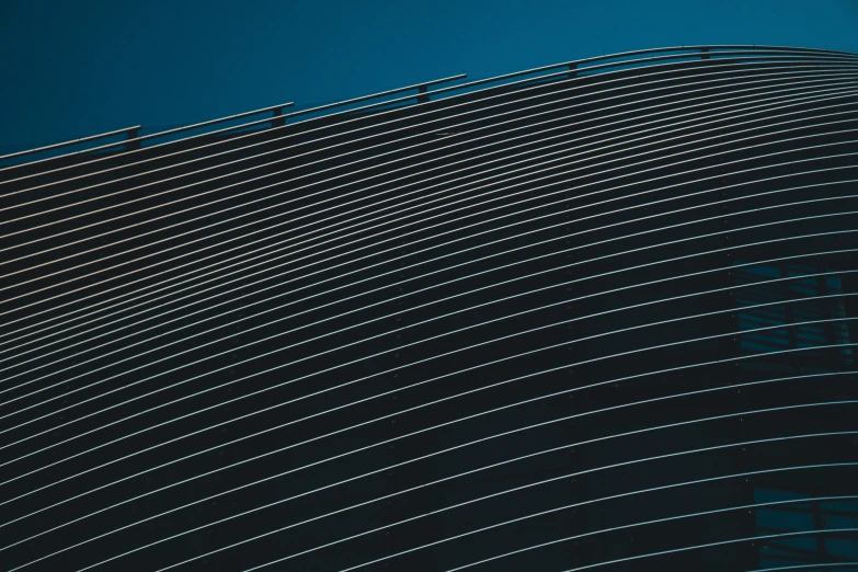 a plane flying over a big blue mountain