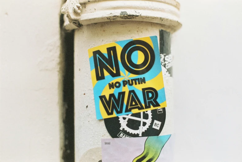 a no war sign on the side of a mailbox